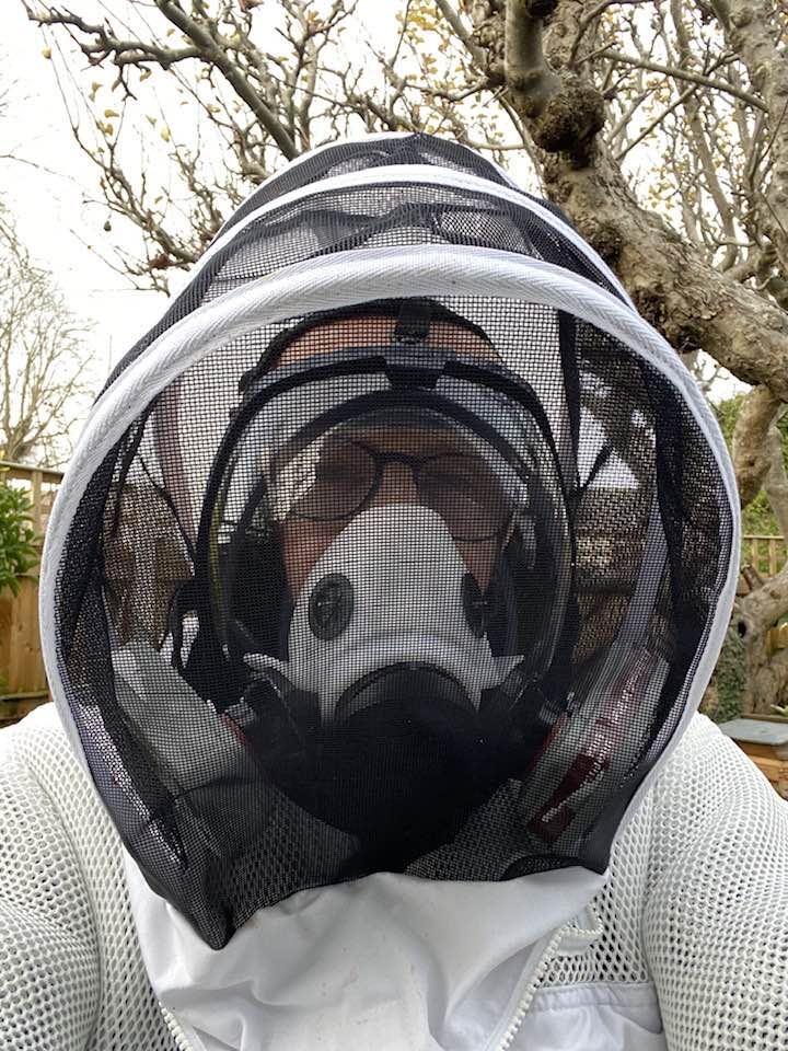 A person wearing a mask and a net